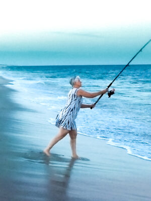Woman Fishing at the Jersey Shore During September's Gloaming