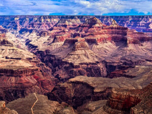 Grand Canyon sandstone peaks resembling swirls of soft ice cream, paused in a moment of golden light